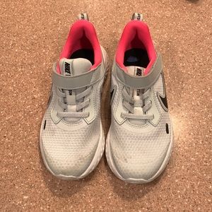 Grey, hot pink and black Nikes